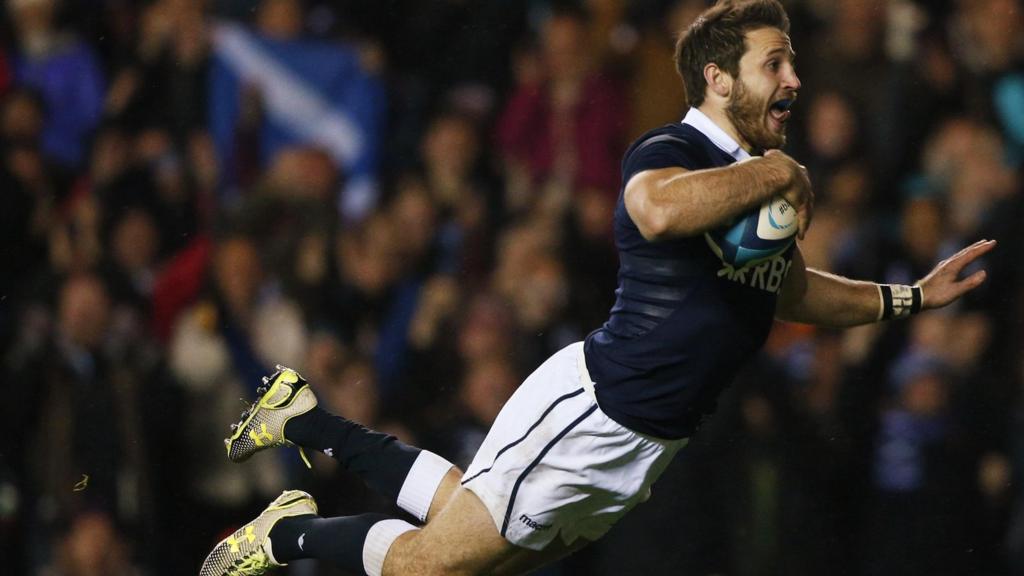 Tommy Seymour dives for the try