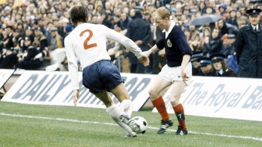 England's David Nish puts pressure on Jimmy Johnstone