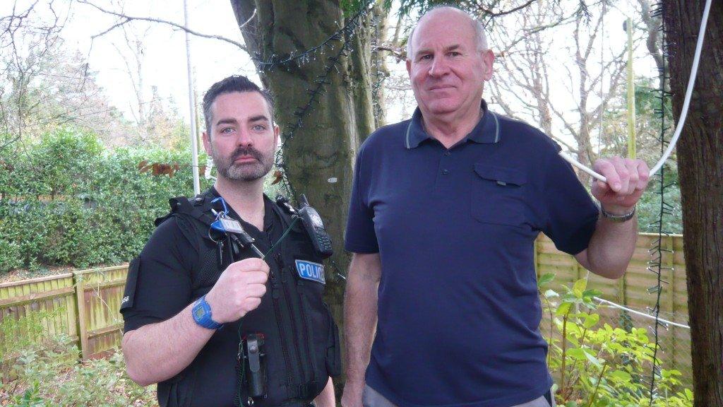 PC Garry Weston and Allan Ward, hospice maintenance officer, with the remaining wire