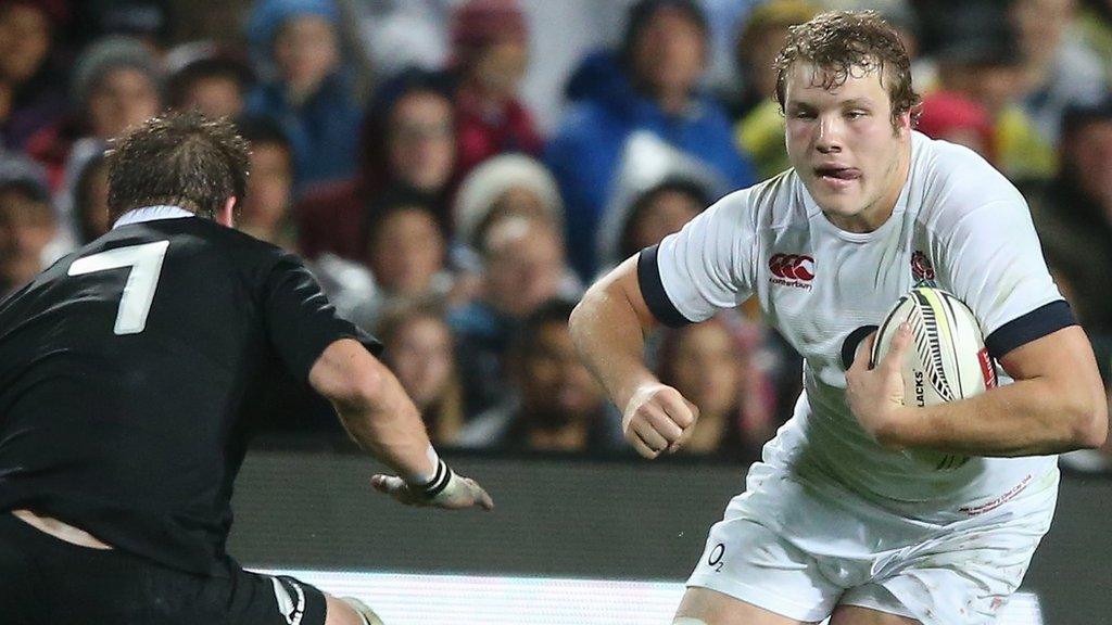 England lock Joe Launchbury takes on New Zealand captain Richie McCaw