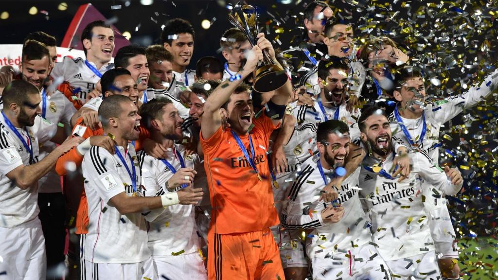 Real Madrid celebrate with the trophy