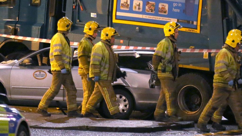 Firefighters at the scene of the fatal crash in George Square, Glasgow