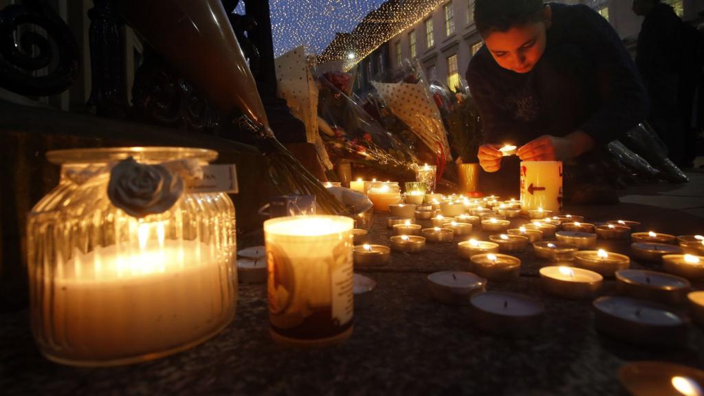 Candle and floral tributes left near the Gallery of Modern Art in Glasgow