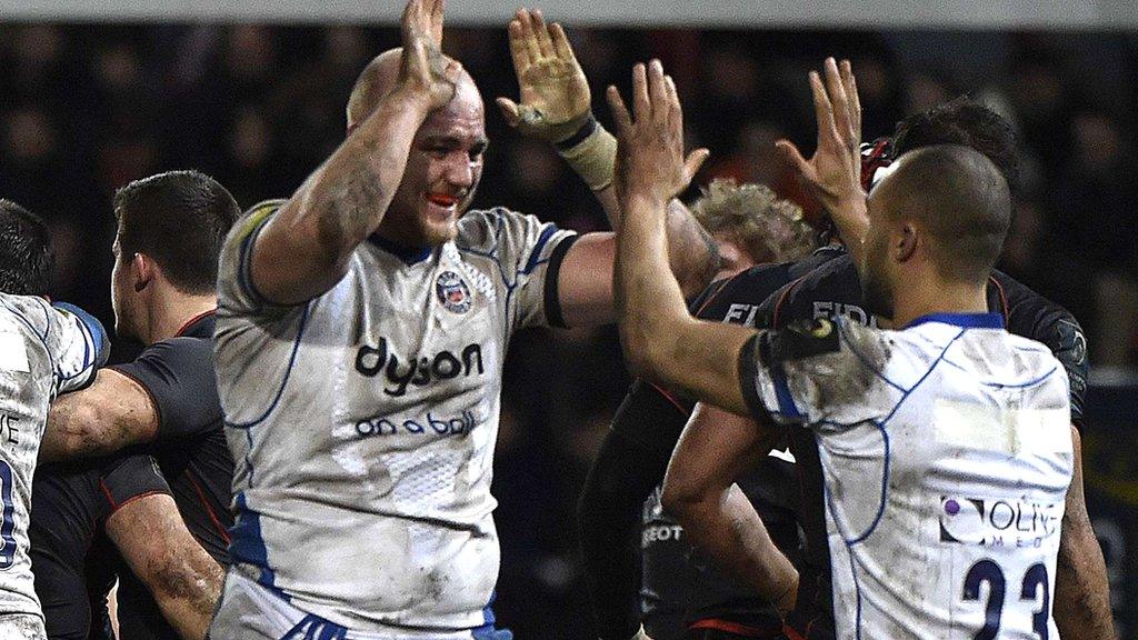 Matt Garvey celebrates Bath's win with Olly Woodburn