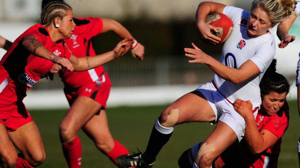 England fly-half Ceri Large is tackled