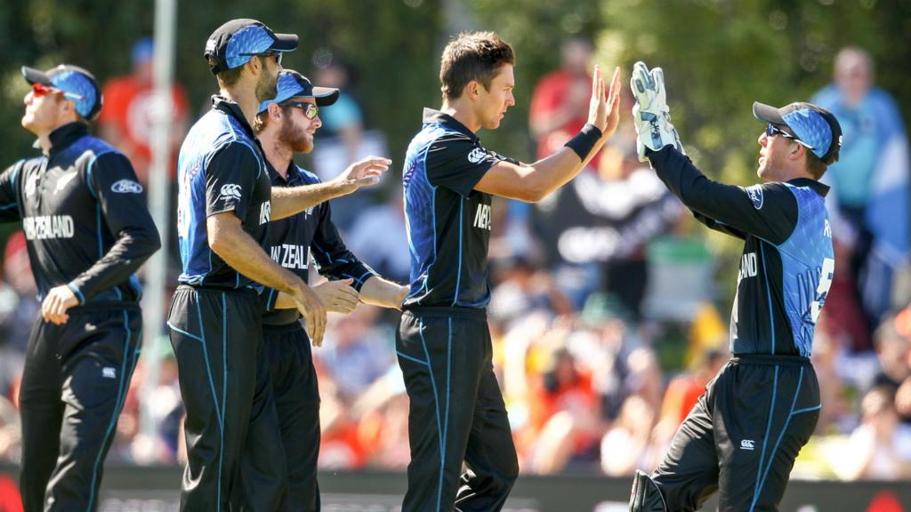 Trent Boult (centre) of New Zealand celebrates