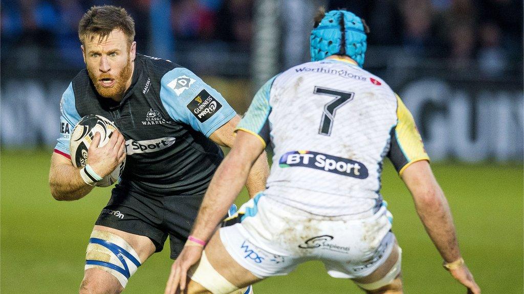 Tyrone Holmes tries to make his way past opposite number Justin Tipuric of Ospreys