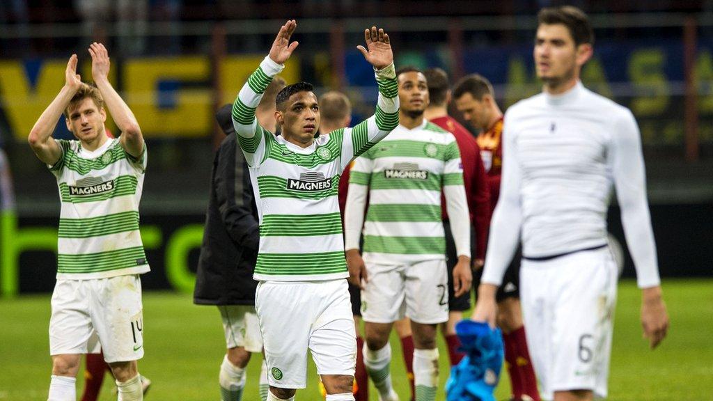 The Celtic players salute the travelling fans