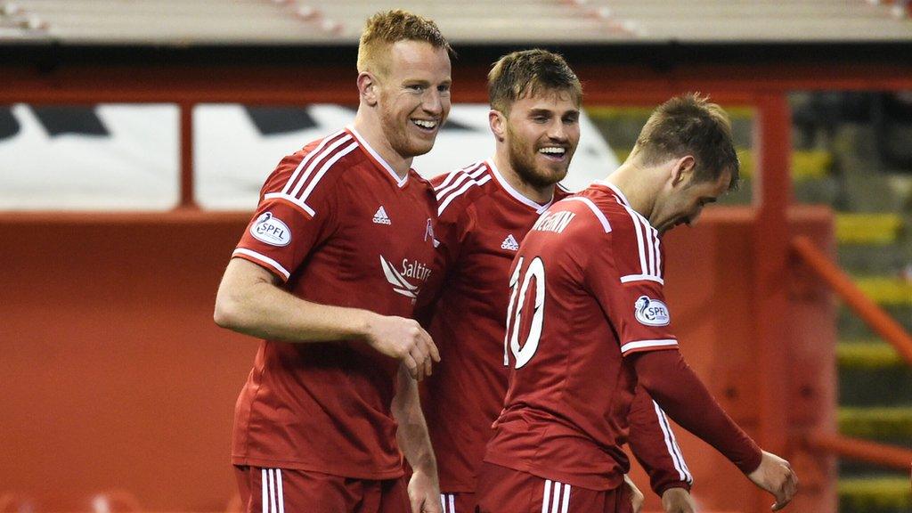 Adam Rooney celebrates his goal with David Goodwillie and Niall McGinn