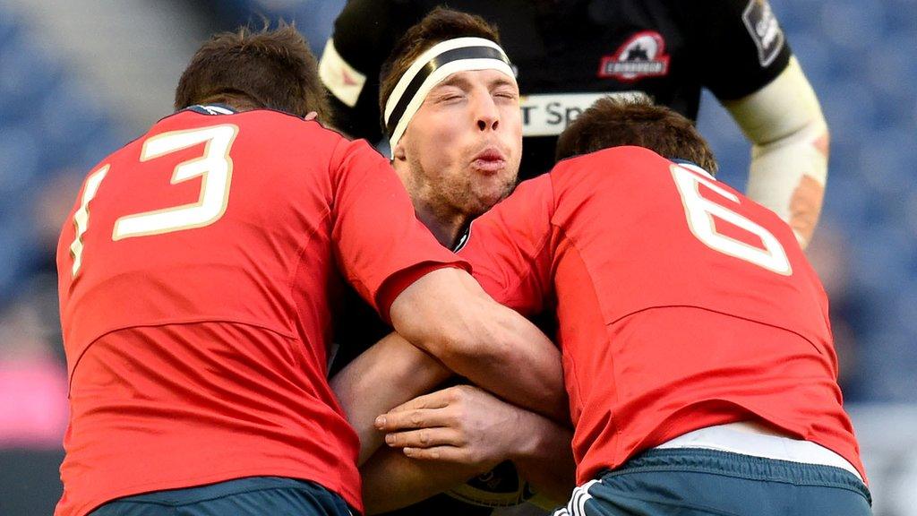 Munster's Andrew Smith and Peter O'Mahony tackle Edinburgh's Alasdair Dickinson