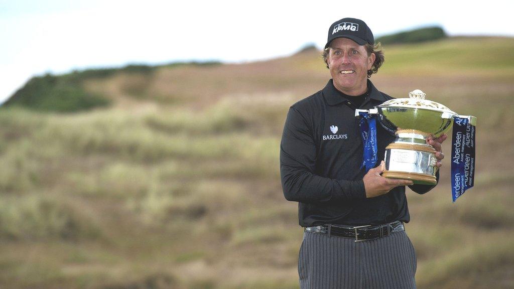 Phil Mickelson holds the Scottish Open trophy in 2013