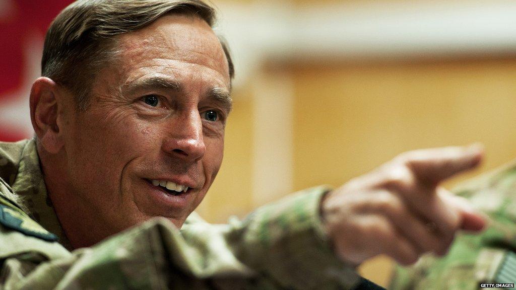 General Petraeus smiling and pointing his finger