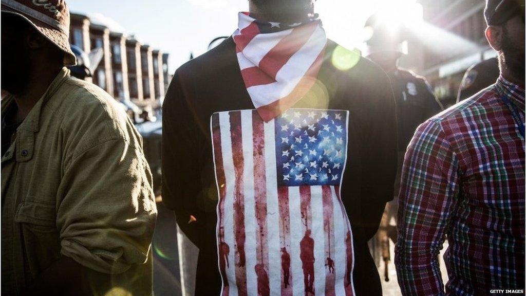 A man stands near police lines