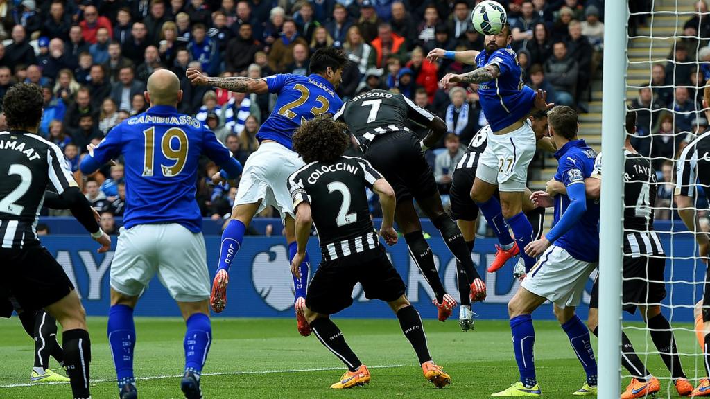 Leonardo Ulloa of Leicester City heads the opening goal against Newcastle United