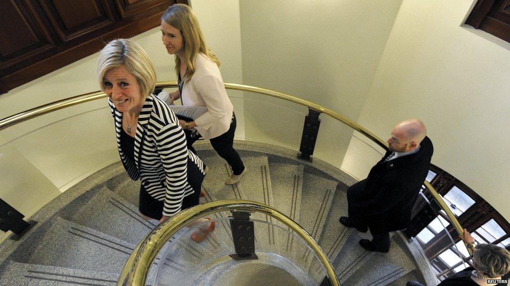 Alberta New Democratic Party (NDP) leader Rachel Notley (L) and her staff enter the Alberta Legislature Building via a spiral staircase for the first time as Premier-elect in Edmonton May 6, 2015.