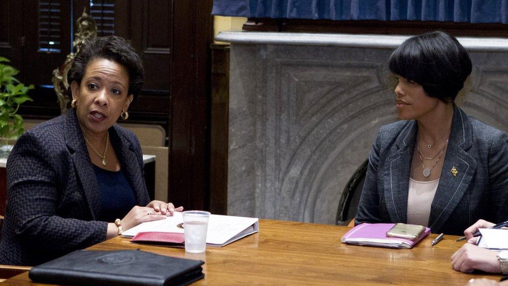 Loretta Lynch and Stephanie Rawlings-Blake sitting at a table