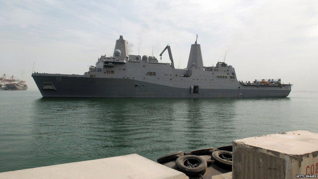 In a photo from March 2009, the USS New Orleans arrives at Mina Salman pier