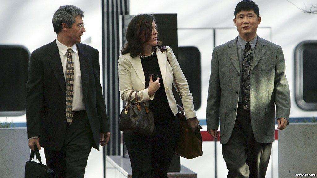 Xiaodong Sheldon Meng (R) arrives at the Robert F. Peckham Federal Building and U.S. Courthouse with his attorneys December 18, 2006 in San Jose, California.