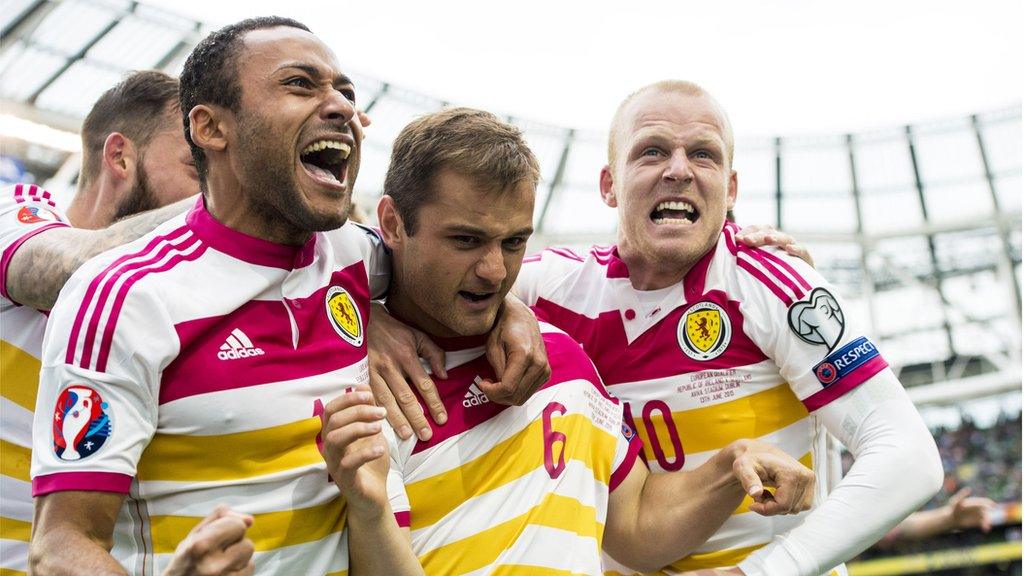 Ikechi Anya and Steven Naismith celebrate Shaun Maloney's deflected equaliser