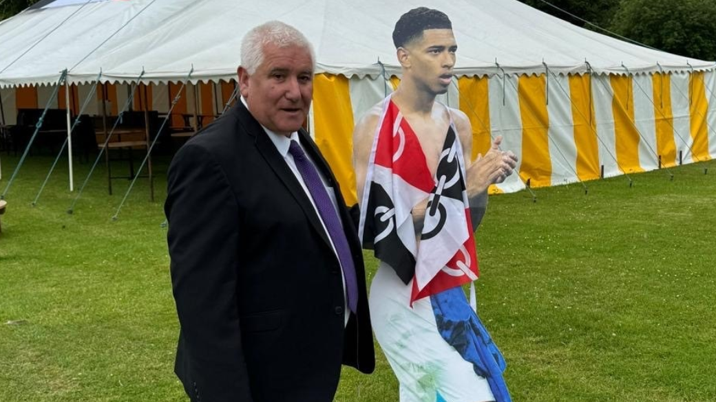 Council leader Patrick Harley alongside a life size cut out of footballer Jude Bellingham