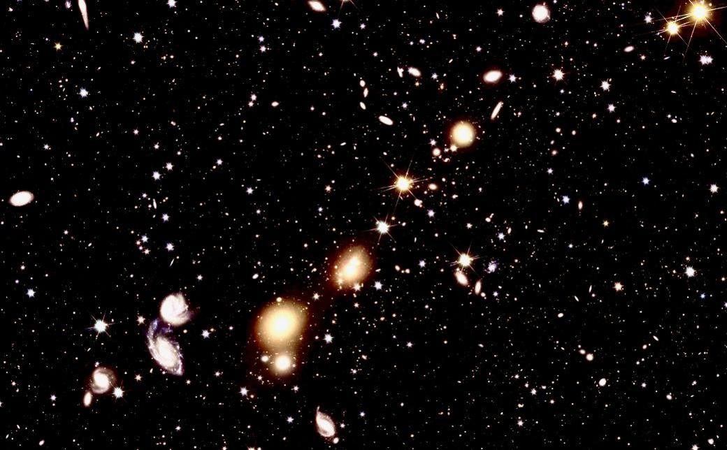 A collection of galaxies in space of various sizes.