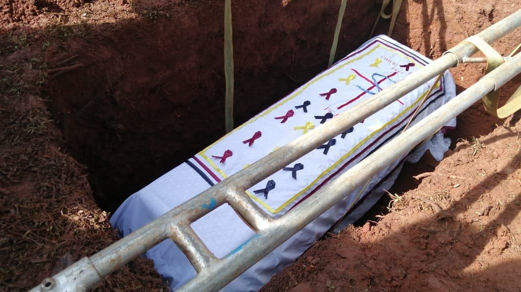 Coffin being lowered into the ground