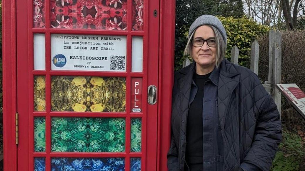 Bronwyn Oldham next to the telephone box