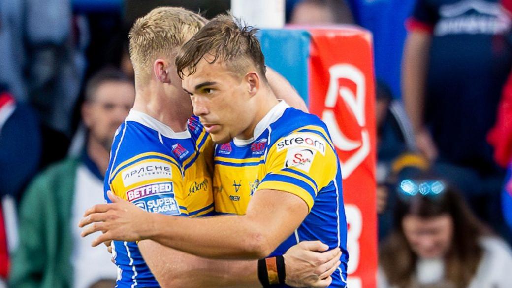Presley Cassell (right) celebrates his try for Leeds Rhinos
