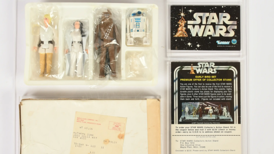 A set of figurines of Luke Skywalker, Princess Leia, Chewbacca and R2D2.