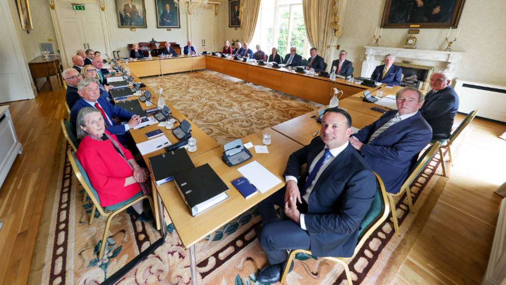 The Irish council of state meets in a large room - they sit around a series of rectangular tables arranged into a larger rectangle with a space in the middle