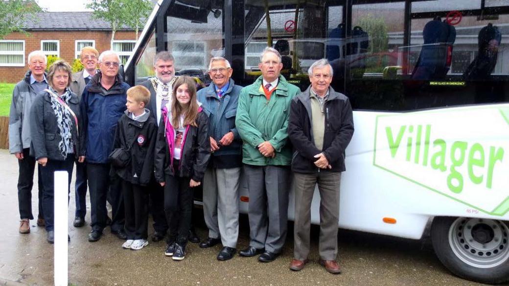 Passengers on a village bus service 