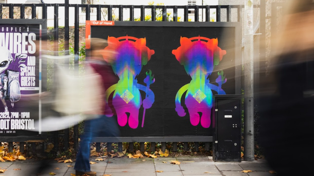 A stylised image with a poster on a street railings showing two CGI-generated images of multi-coloured animals wearing headphones, on a black background. There is a blurred image of a pedestrian walking past.