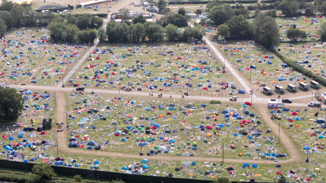 Aerial view, taken by a drone, of Reading Festival aftermath with scattered tents and rubbish left behind by festival-goers.