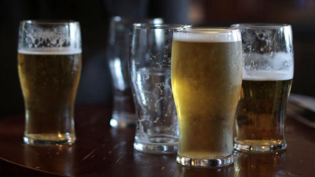 Beer glasses on a pub table