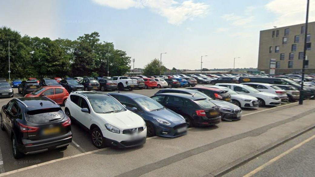 A car park in Barnsley shows dozens of cars parked in three rows