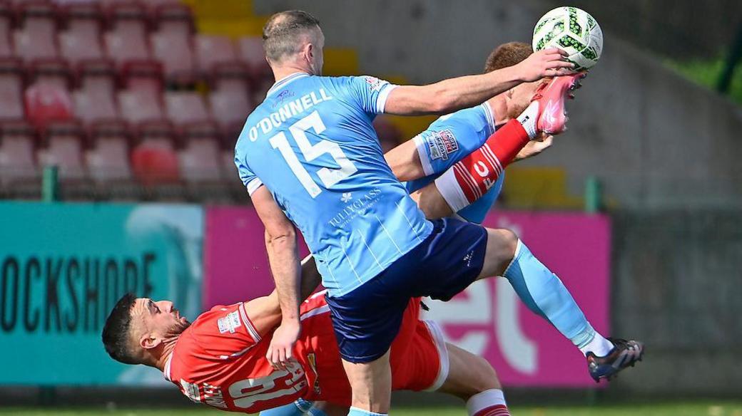 Stephen O'Donnell contends for possession with Joe Gormley