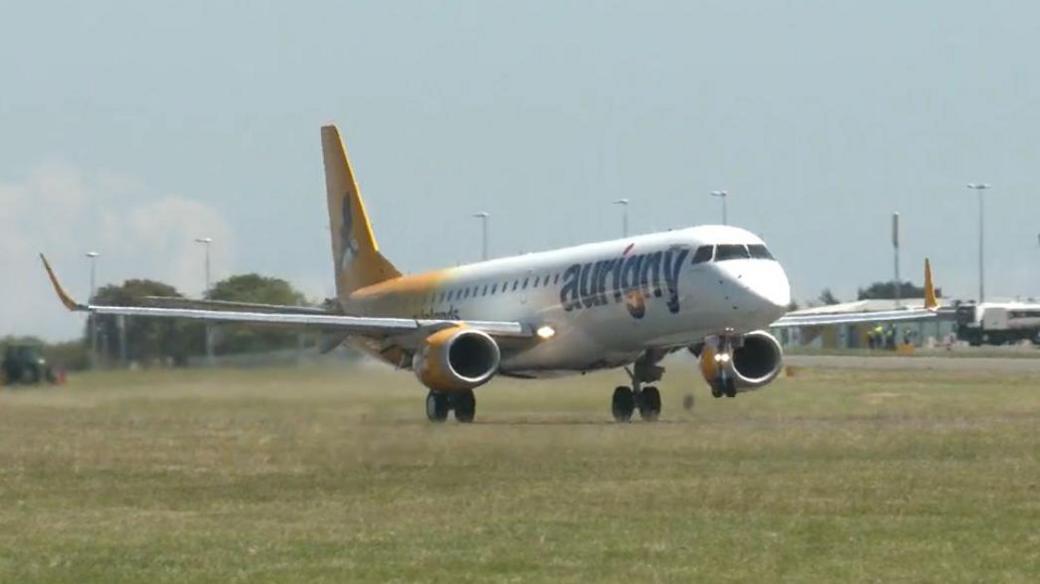 An Aurigny-branded jet landing at Guernsey airport 