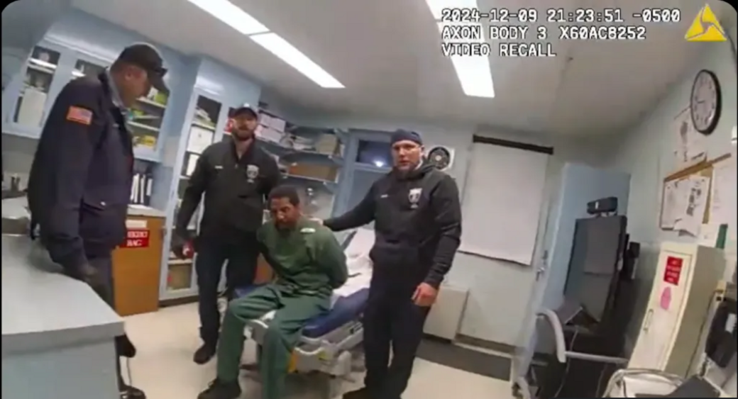 Police body cam footage shows Brooks sitting on an examination bed