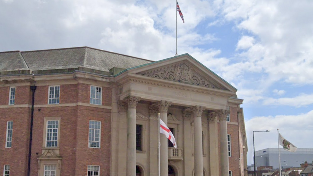Derby City Council House with a flag of St George visible in the foreground