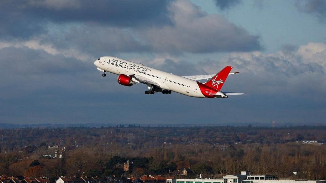 A Virgin Atlantic aircraft takes off from Heathrow in November 2023, the first 100% Sustainable Aviation Fuel transatlantic flight.