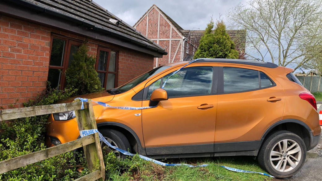 Car in side of house