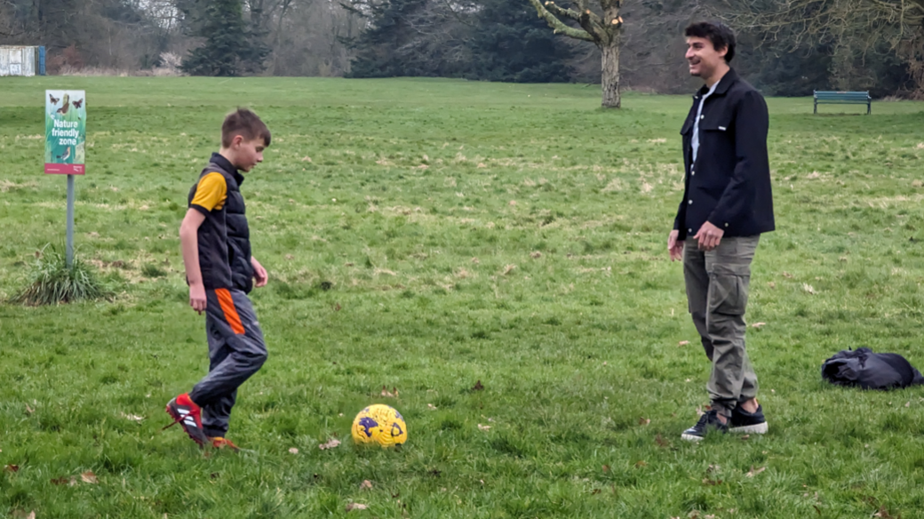 Oscar and Mr Bueno playing football together