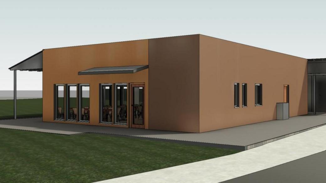 A CGI showing the cafe from another angle. The rectangular building has brown walls and tall glass windows.