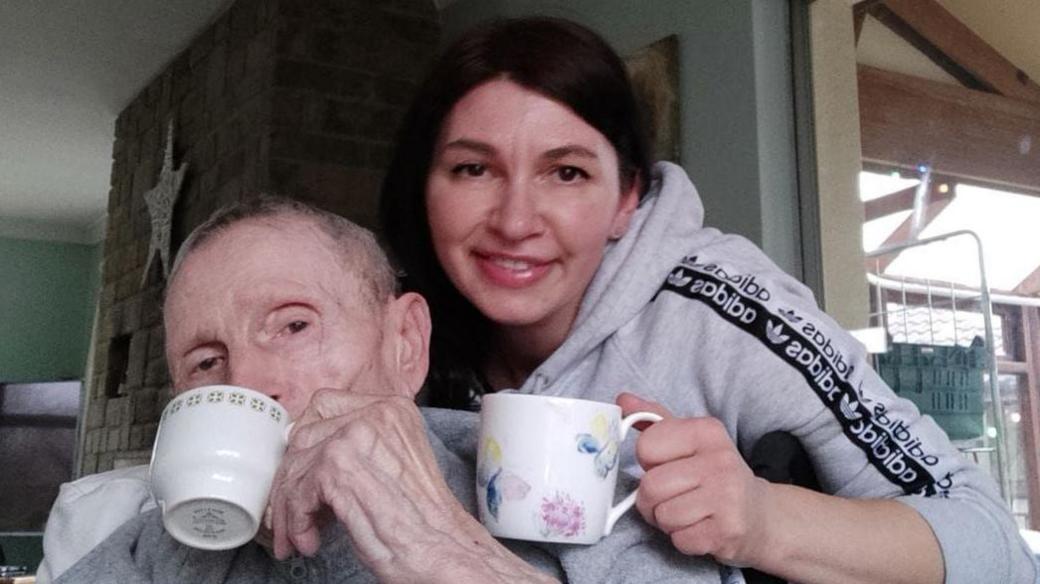 Iryna and Victor together drinking from mugs