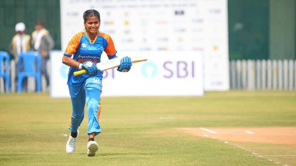 Deepika TC, the captain of India's blind women's cricket team pictured running with her bat. 