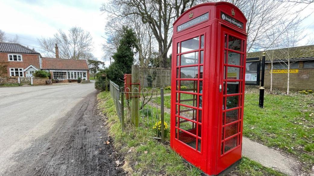 A red phone box in Thurne, Norfolk