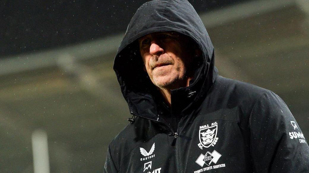 Hull FC head coach John Cartwright in a club issued coat
