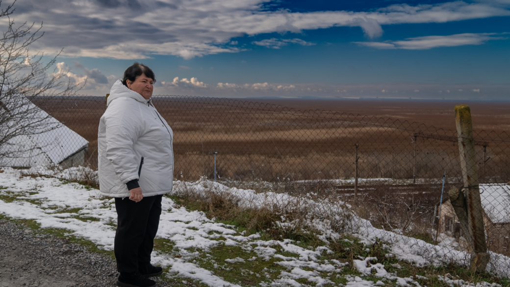 Lyudmyla looks over reservoir