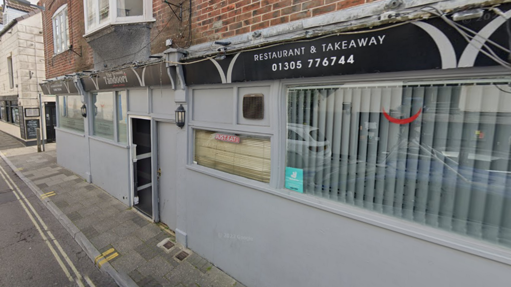 A general view of the Weymouth Tandoori restaurant, which has grey paint on its outside 