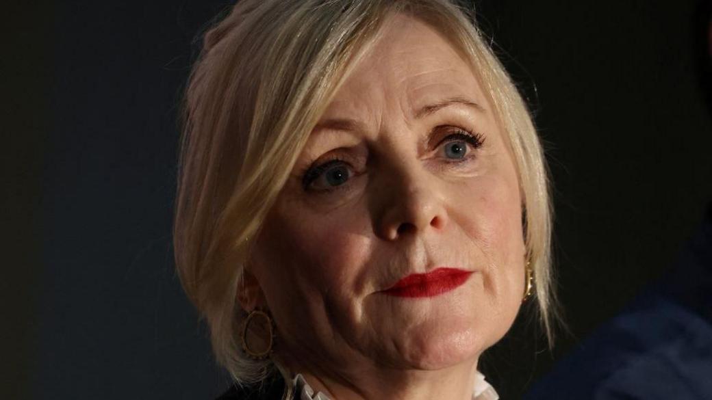 A head shot of Tracy Brabin. She has blonde, chin-length hair and red lipstick.